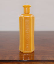 Load image into Gallery viewer, beeswax candle in the shape of an old poison bottle