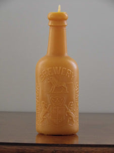 beeswax candle in the shape of an antique Alnwick brewery bottle