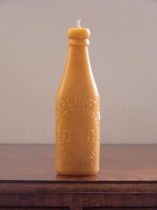 beeswax candle in the shape of an antique Darlington bottle