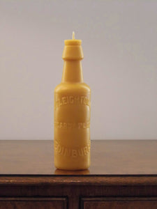 beeswax candle in the shape of an antique Edinburgh bottle